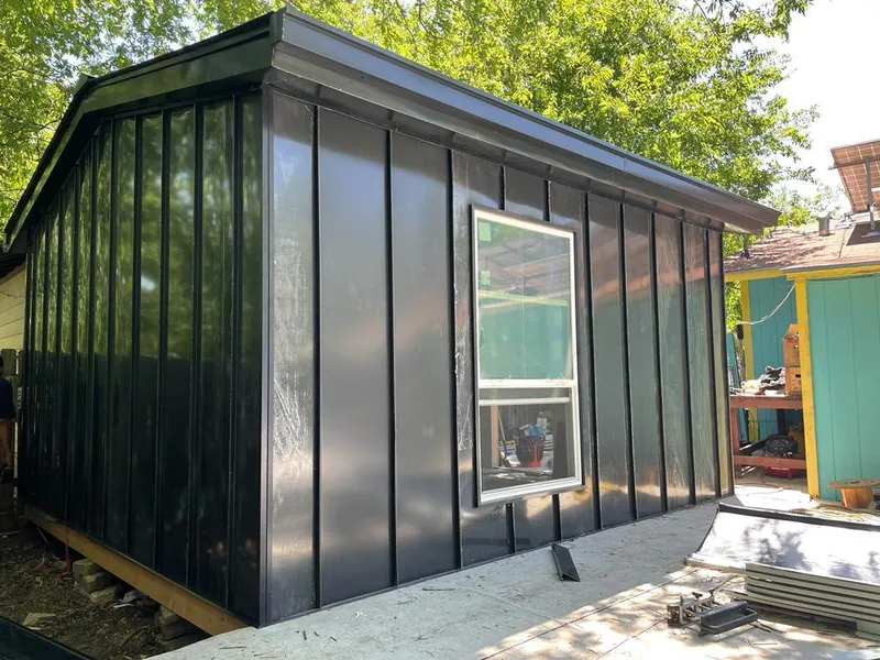 Black standing seam metal wall panels for Roof Inspection in Hiram